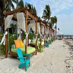 Beach beds with canopy on the beach in Cancun, Mexico
