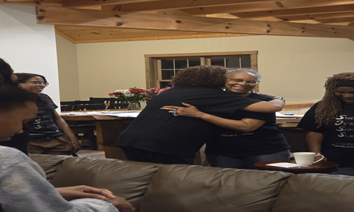 Women exchanging beads for Spiritual meanings